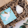 Load image into Gallery viewer, The Light Lovers candle box featuring an unscented soy wax natural-wax pillar candle and a box of letterpress matches in a sustainanly made gift box.