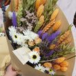 Load image into Gallery viewer, Sustainable dried wildflower bouquet featuring lavender, cornflowers, bunny tails. orange strawflowers, yellow yarrow, and preserved roses on a white surface. Plastic-free, long-lasting arrangement with rustic wheat stems and a natural tag. Perfect eco-friendly home décor from our forever-lasting collection. Birthday UK. Housewarming present when you don't know what to buy. Lavender & Peach flower bunch bouquets. Flowers for birthdays. Long lasting flowers. Dried flower bouquets