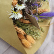 Load image into Gallery viewer, Sustainable dried wildflower bouquet featuring lavender, cornflowers, bunny tails. orange strawflowers, yellow yarrow, and preserved roses on a white surface. Plastic-free, long-lasting arrangement with rustic wheat stems and a natural tag. Perfect eco-friendly home décor from our forever-lasting collection. Birthday UK. Housewarming present when you don't know what to buy.