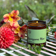 Load image into Gallery viewer, Our candles are all hand poured with natural plant based wax. Hand poured in the UK and poured in a brown amber glass by our female owned team. Long lasting candles that fully scent a room. Our candles are complete with a gold alliminium lid and then packaged in a beautiful botanical box, which features candle safety instructions in a cottage core theme. They are long lasting candles, rated excellent on Trust Pilot and fully scent a room.