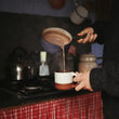 Load image into Gallery viewer, Harth hot chocolate being whisked in saucepan - traditional Swiss style preparation method
