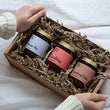 Load image into Gallery viewer, Natural-wax Candle Set. Perfect gift for Christmas, birthdays and house warming presents. Our sustainably sourced gift boxes are made with sustainable materials, filled with sustainable scent and feature a hand tired cotton ribbon. Perfect for gifts, such as birthday presents, housewarming and sympathy gifts. Bespoke and customisable gift boxes UK.