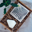 Load image into Gallery viewer, The Light Lovers candle box featuring an unscented soy wax natural-wax pillar candle and a box of letterpress matches in a sustainanly made gift box.