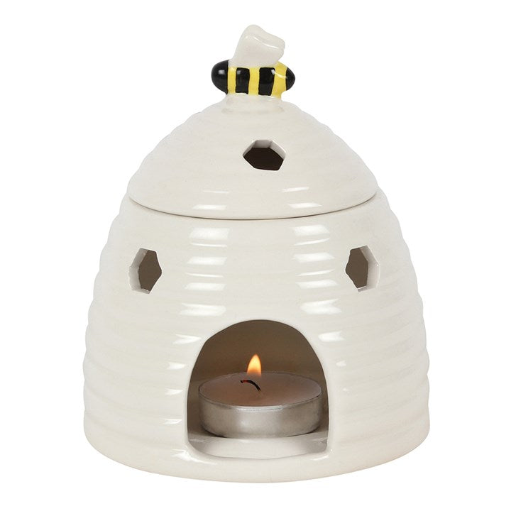 Beehive Wax Melt Burner best paired with wax melts or wax tarts. Elegant ceramic wax melt burner paired with our handcrafted botanical wax melts and tealights. Stylish home fragrance solution designed for long-lasting and strong scent release. Premium quality ceramic burner with cut outs to let the light shine through. Best paired with plant based natural wax tealights and soy wax melts from The Flora Lab  