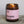 Load image into Gallery viewer, Stargazer Scented Natural Wax Candle. Stargazer Flora Scented Candle. Our candles are all hand poured with natural plant based wax. Hand poured in the UK and poured in a brown amber glass by our female owned team. Long lasting candles that fully scent a room. Our candles are complete with a gold alliminium lid and then packaged in a beautiful botanical box, which features candle safety instructions in a cottage core theme. They are long lasting candles, rated excellent on Trust Pilot and fully scent a room.
