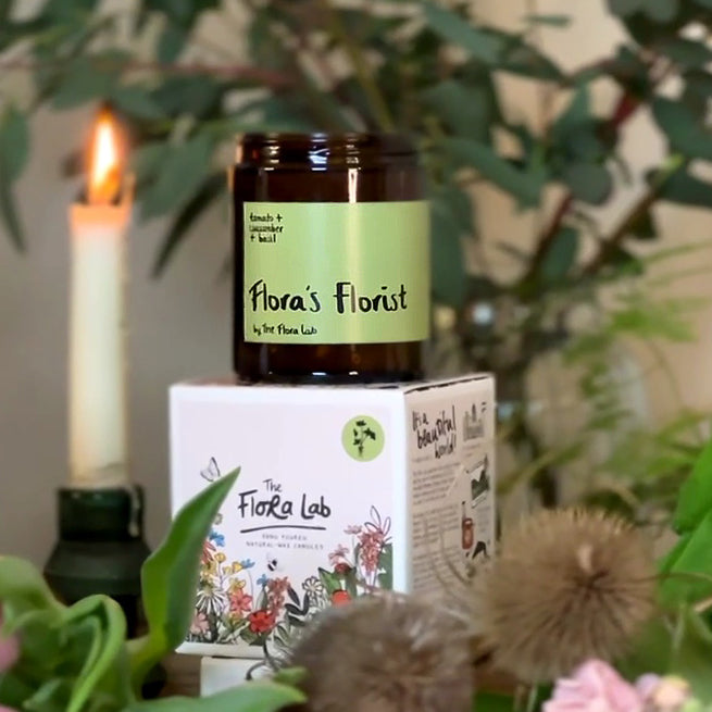 Flora's Florist Natural Wax Candle. Flora's Florist Green Based Candle. Candles that are great for spring summer. Spring summer candles. Green Tomato Candles. Salad smelling candles. Candles that smell like the outside. Green Candle Scents. Hand poured natural wax candles. Small Business Candles. Hand poured Natural- Wax candles. Candles that actually smell of something. natural candles. Comes with botanical box that's great for gifting. Single Wick Candle Long burn time. 