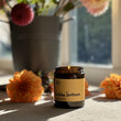 Load image into Gallery viewer, Sicilian Sunbeam Italian Summer Candle. Great Candle for Summer time. Really romantic frgarance with Neroli, Mandarin and Basil Candle. Lots of citrus based notes. Yellow Candle. Image shows a long lasting plant based candle lit. 
