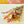 Load image into Gallery viewer, Pastel dried wildflower bouquet with pink daisies, yellow strawflowers, and wheat grass wrapped in kraft paper, perfect for sustainable home decor, wedding gifts, or bohemian floral arrangements
