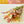 Load image into Gallery viewer, Pastel dried wildflower bouquet with pink daisies, yellow strawflowers, and wheat grass wrapped in kraft paper, perfect for sustainable home decor, wedding gifts, or bohemian floral arrangements
