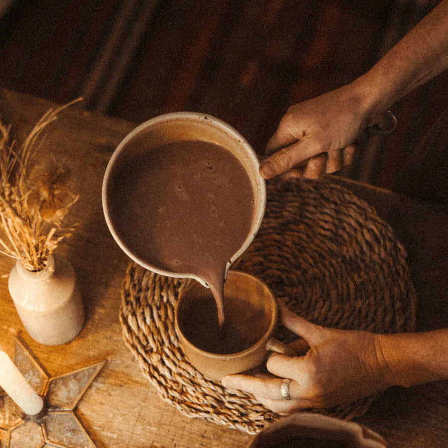 Steaming saucepan of Harth cinnamon hot chocolate with oat milk - warming spiced winter treat