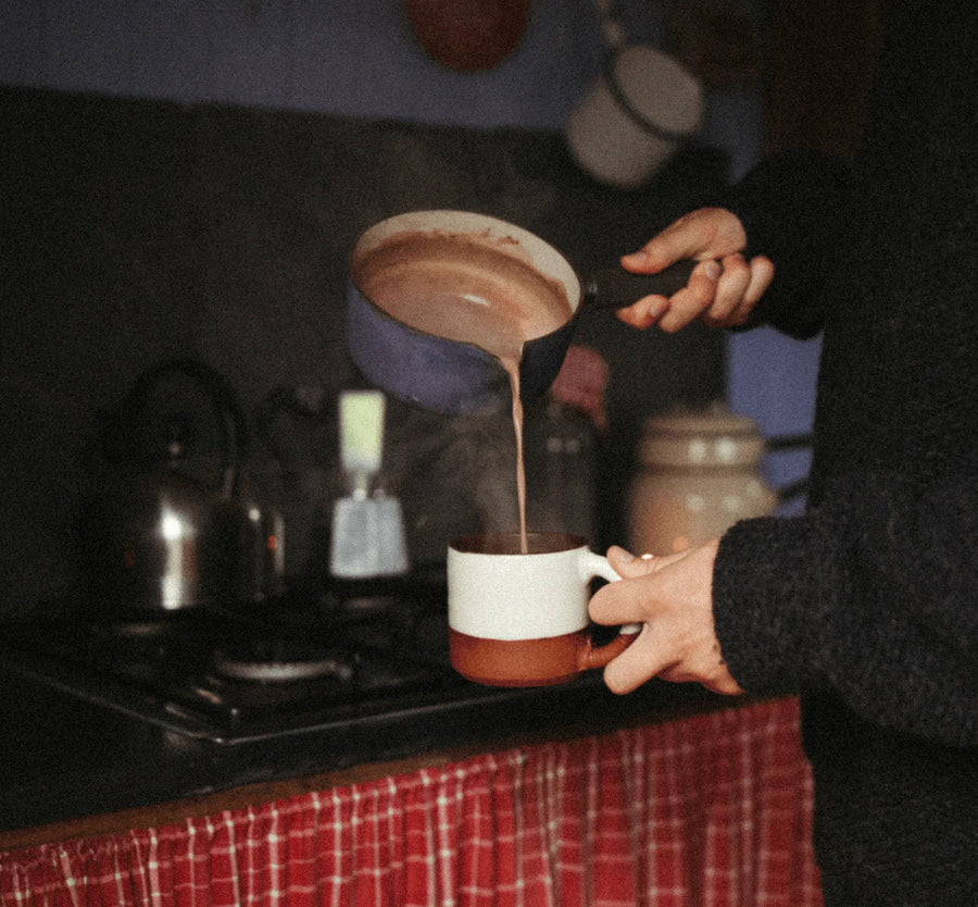 Harth hot chocolate being whisked in saucepan - traditional Swiss style preparation method
