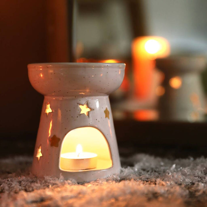 Ceramic Starry Wax Burner. Perfect for evening times. a great present from a small business.  Elegant ceramic wax melt burner paired with our handcrafted botanical wax melts and tealights. Stylish home fragrance solution designed for long-lasting and strong scent release. Premium quality ceramic burner with stars cut out to let the light shine through. Best paired with plant based natural wax tealights and wax melts from The Flora Lab 