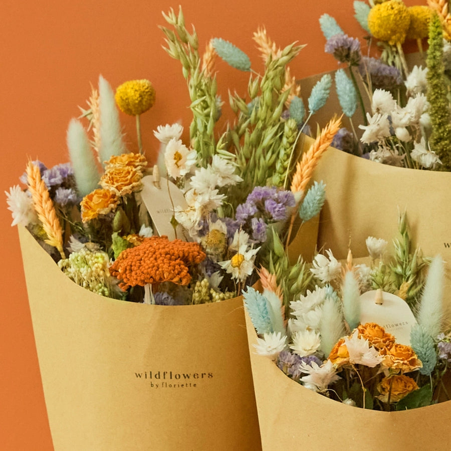 Dried Flowers - Field Bouquet - Pastel Delight all 3 sizes. All sustainably grown and dried. This bouquet contains: Natural oats, natural wheat, pesca wheat, light blue phalaris, light blue lagurus, craspedia, trinity spray roses, green amaranthus, lavender statice, white rhodanthe, and frosted salmon achillea.