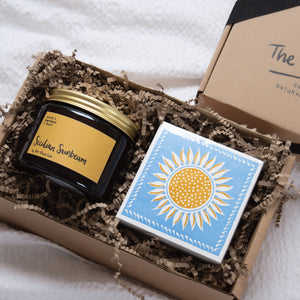 Sicilian Sunbeam Double Wick Candle, luxury Letterpress sunshine match box in our ray of sunshine sustainable gift box. Our sustainably sourced gift boxes are made with sustainable materials, filled with sustainable scent and feature a hand tired cotton ribbon. Perfect for gifts, such as birthday presents, housewarming and sympathy gifts. Bespoke and customisable gift boxes UK. Beautiful botanical gift. 