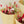 Load image into Gallery viewer, festive hand-tied field bouquet combines natural tones with striking reds, pinks, and copper hues for a passionate and lively touch. This bouquet contains: Natural oats, light pink phalaris, bordeaux lagurus, red phalaris, copper poppy, white limonium, dark pink helichrysum, lianne spray roses, bordeaux broom bloom, and red beetal.
